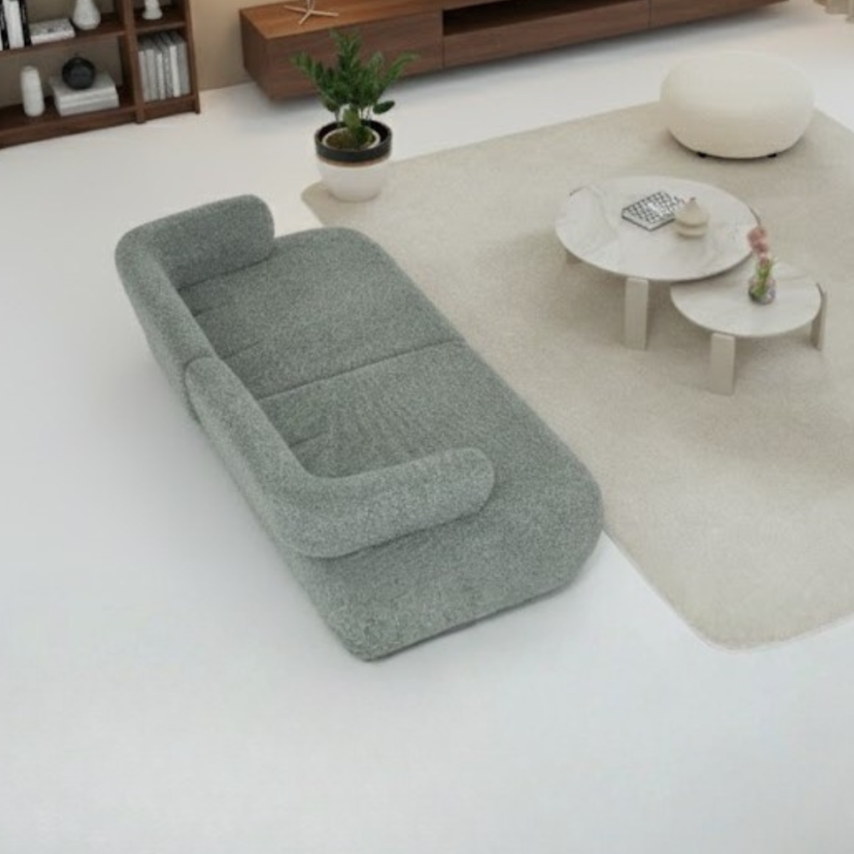Gray sofa in a modern living room with a coffee table and decor items.