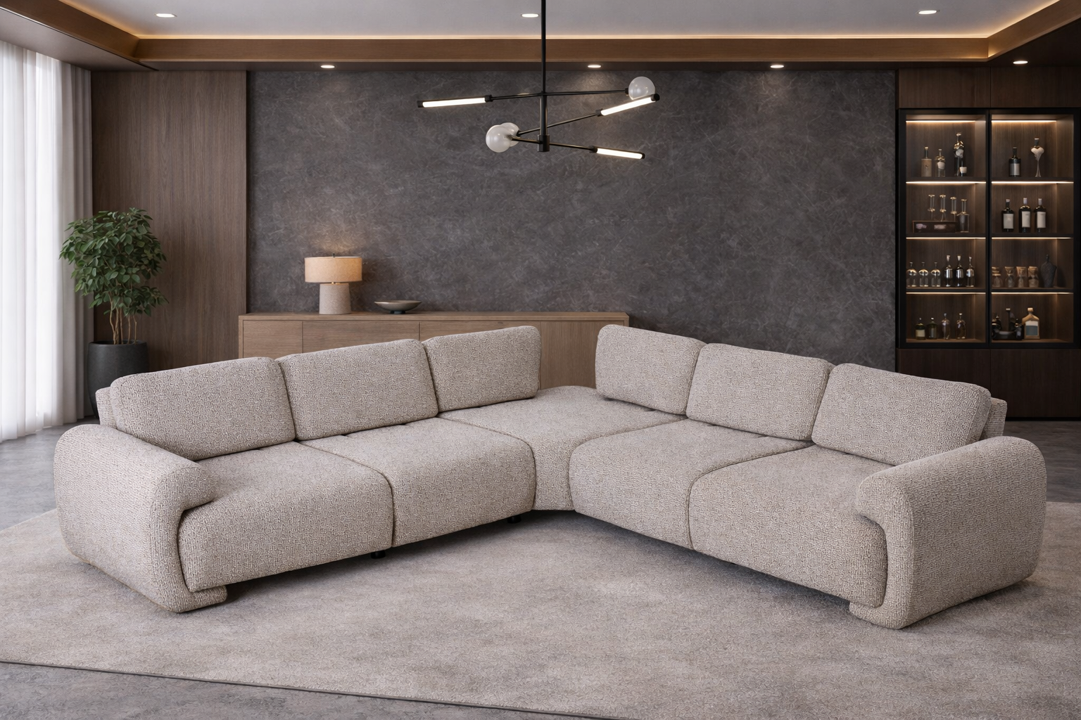 Modern living room with a large beige sectional sofa against a dark wall.