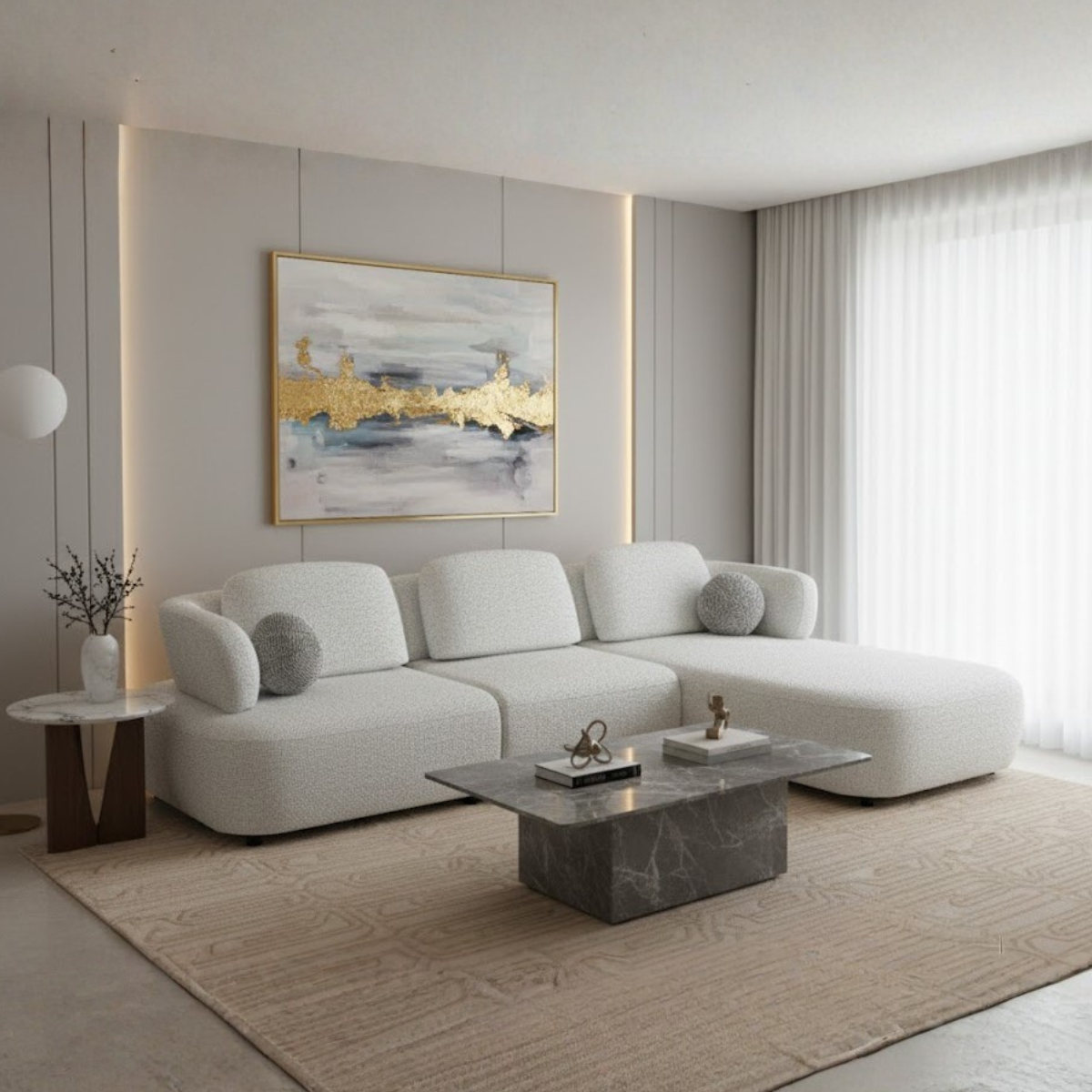 Modern living room with a white sectional sofa, marble coffee table, and abstract art on the wall.