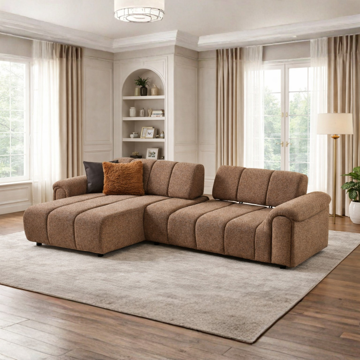 Brown sectional sofa in a living room with large windows and neutral decor.