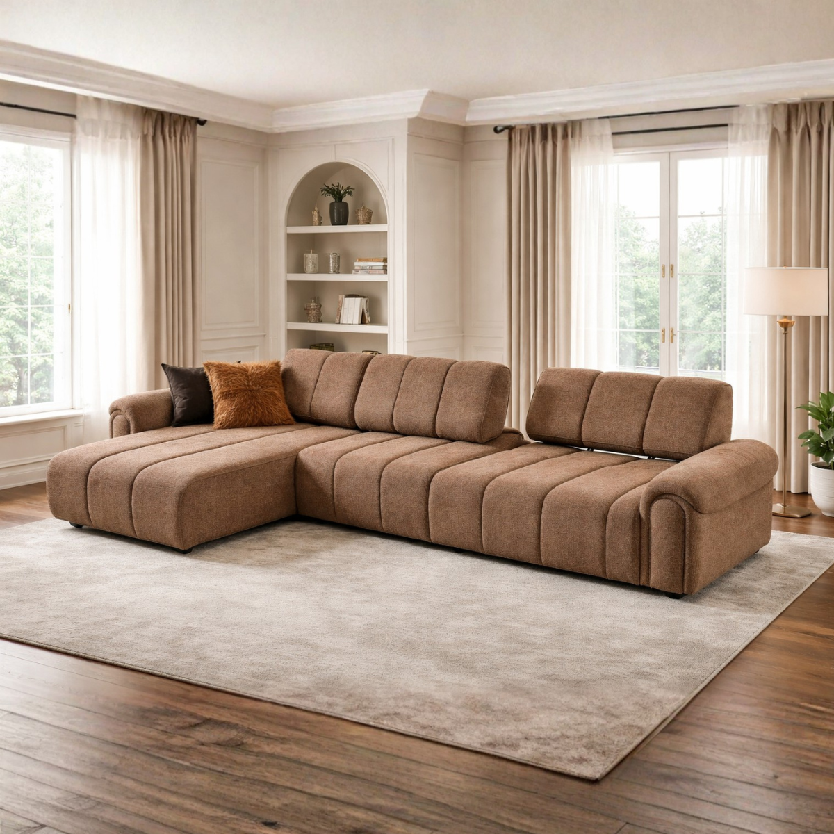 Brown sectional sofa in a living room with large windows and curtains.