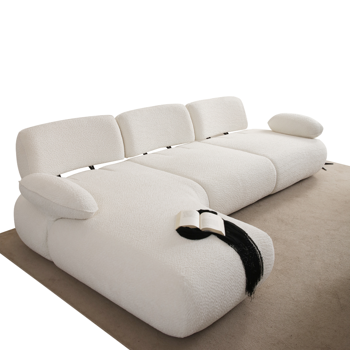 Modern white sofa with a black ribbon on a beige carpet