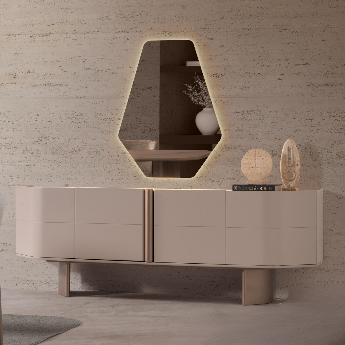 Modern beige entertainment console with a mirror and decorative items against a textured wall.