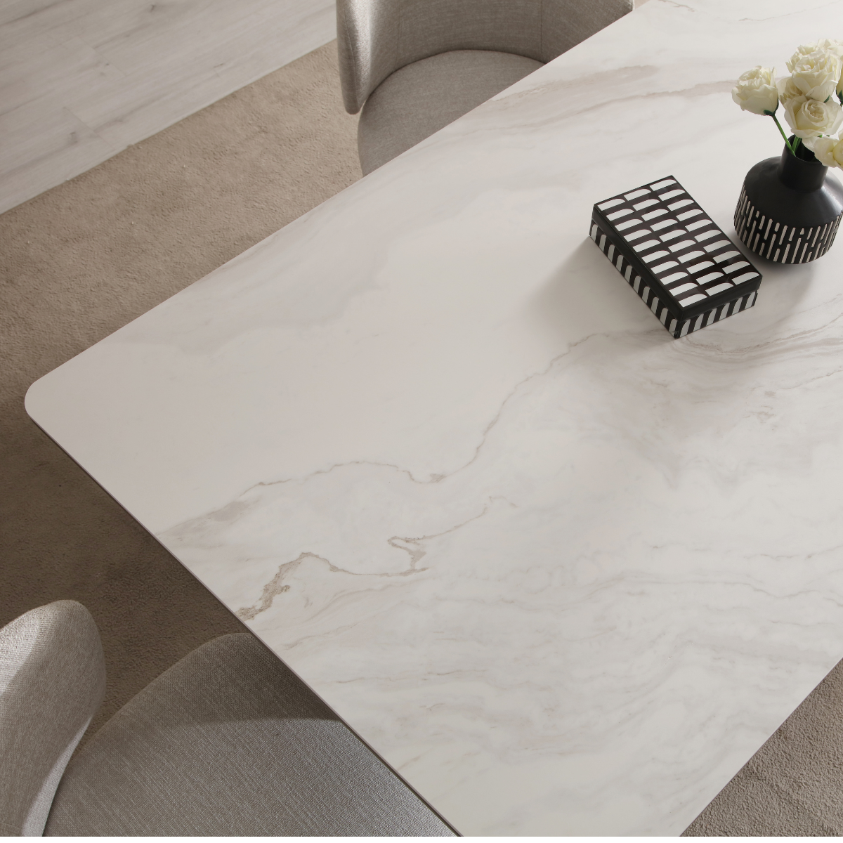 Marble-patterned coffee table in a living room setting with decorative items.