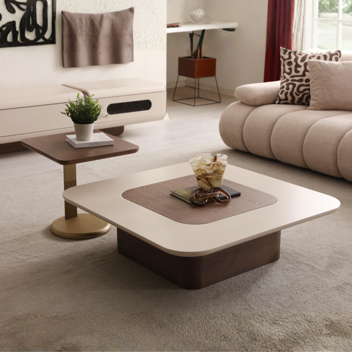 Modern living room with a coffee table and decorative items.
