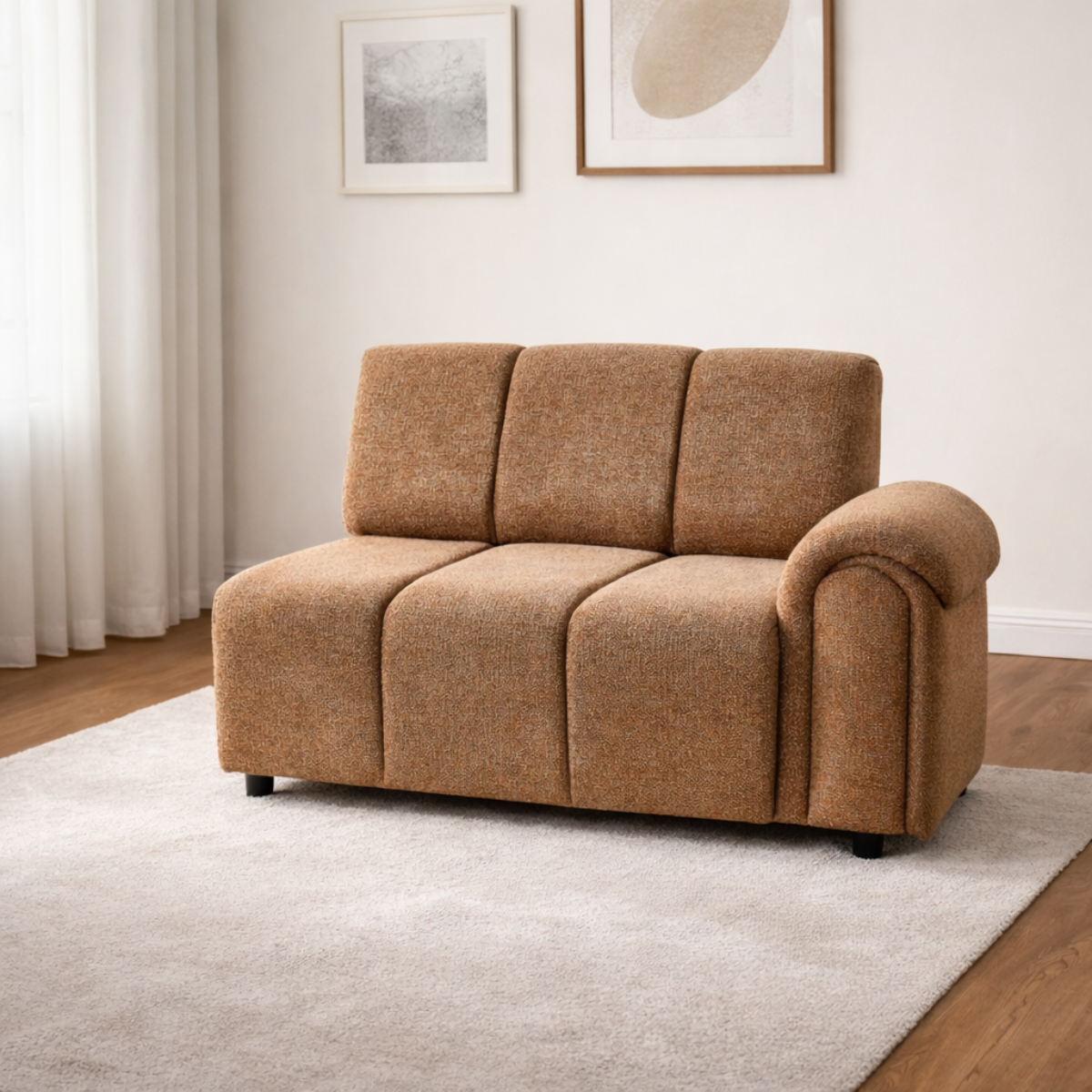 Brown sofa in a living room with framed pictures on the wall.
