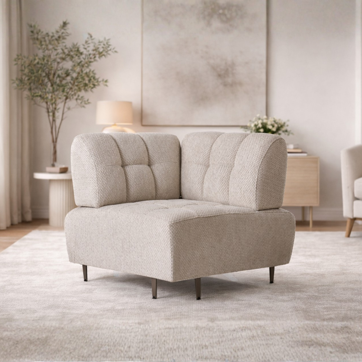 Beige armchair in a living room setting with decor elements.