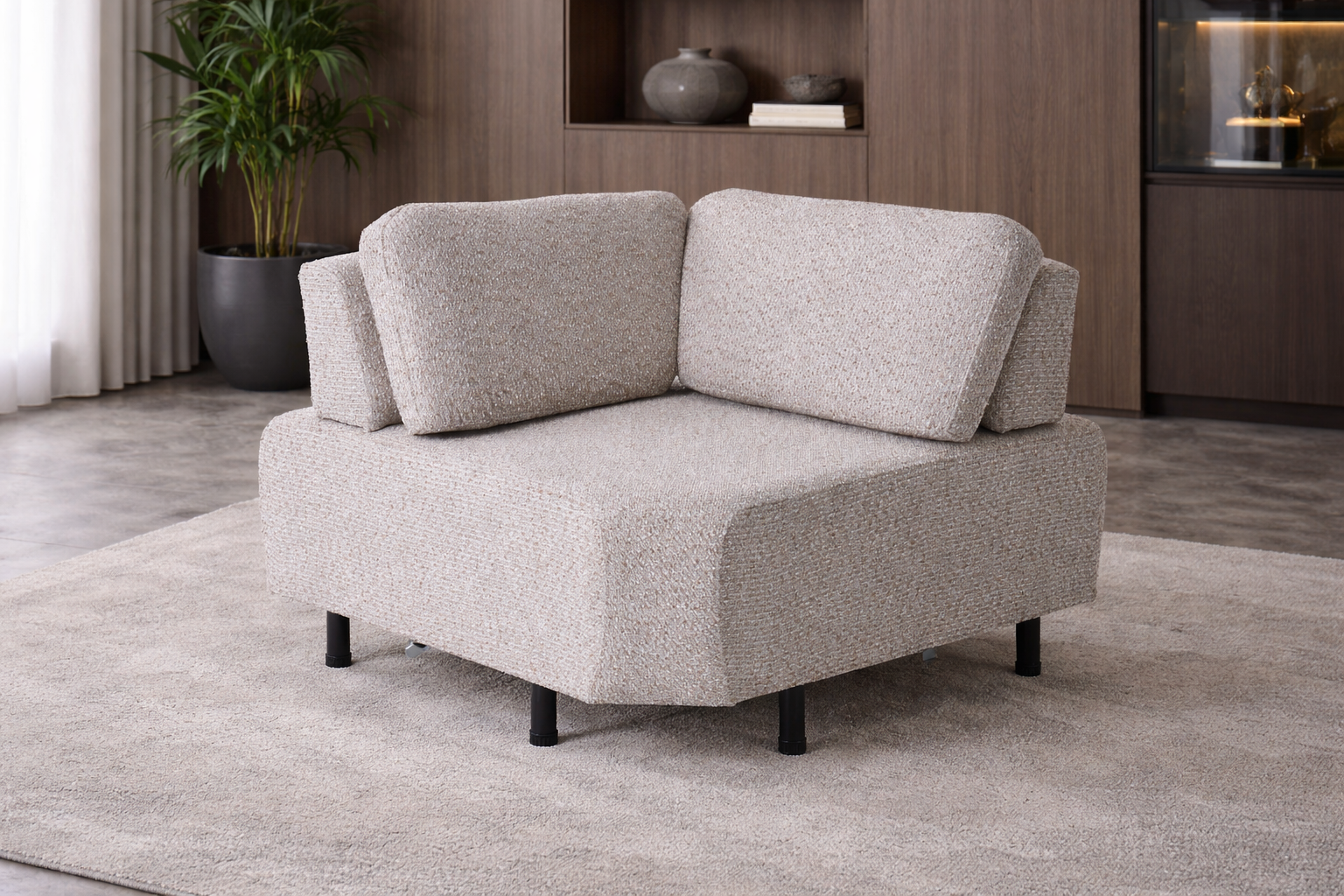 Gray sectional sofa in a room with wooden shelves and plants.