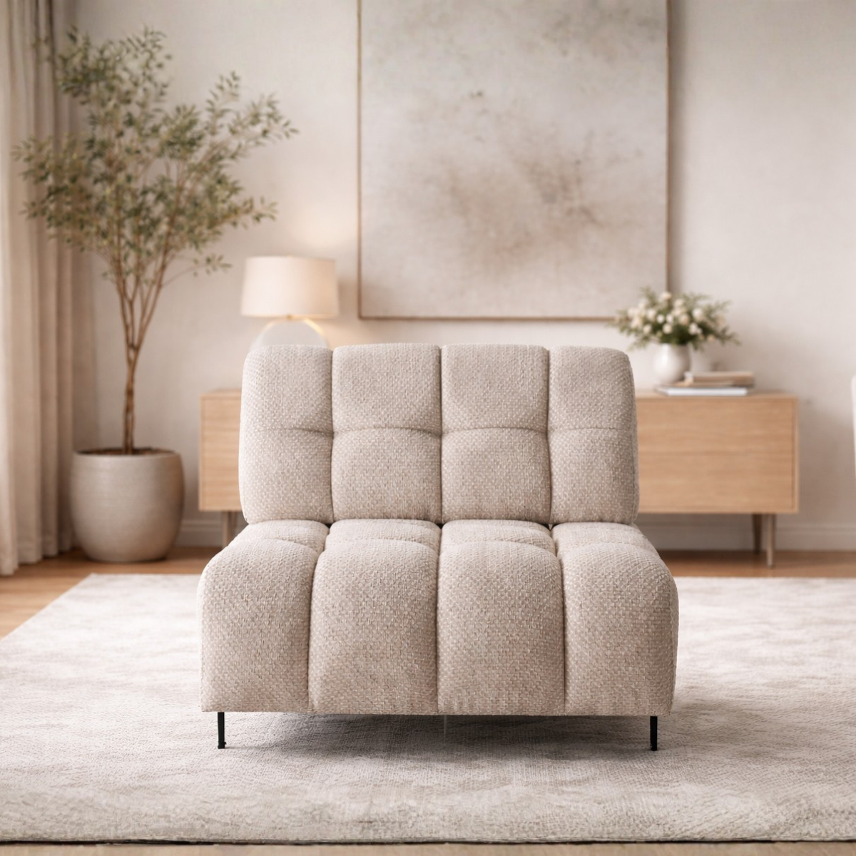 Beige armchair in a living room setting with decor elements.
