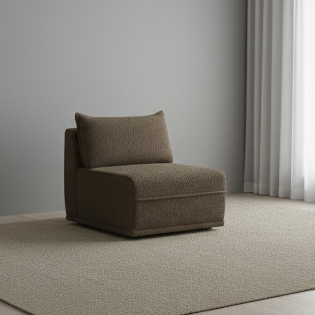 Brown armchair with a pillow on a neutral-colored floor and wall.