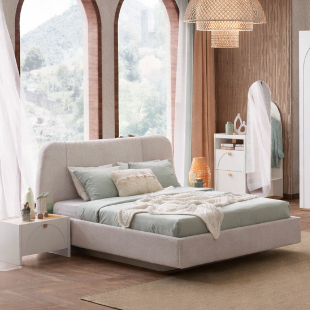 Modern bedroom with a large bed, nightstands, and a view of trees outside the window.