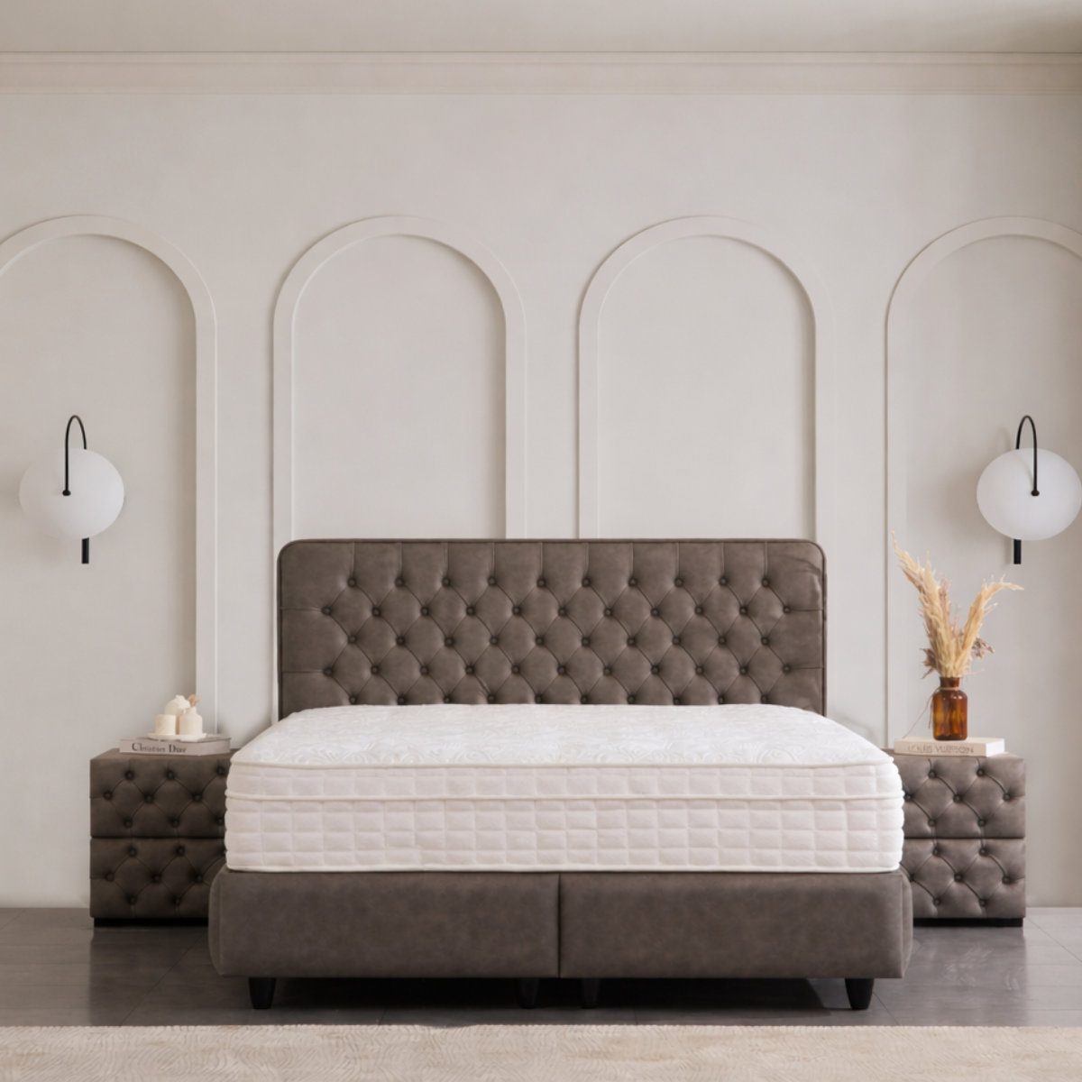 Gray upholstered bed with tufted headboard in a modern bedroom setting.