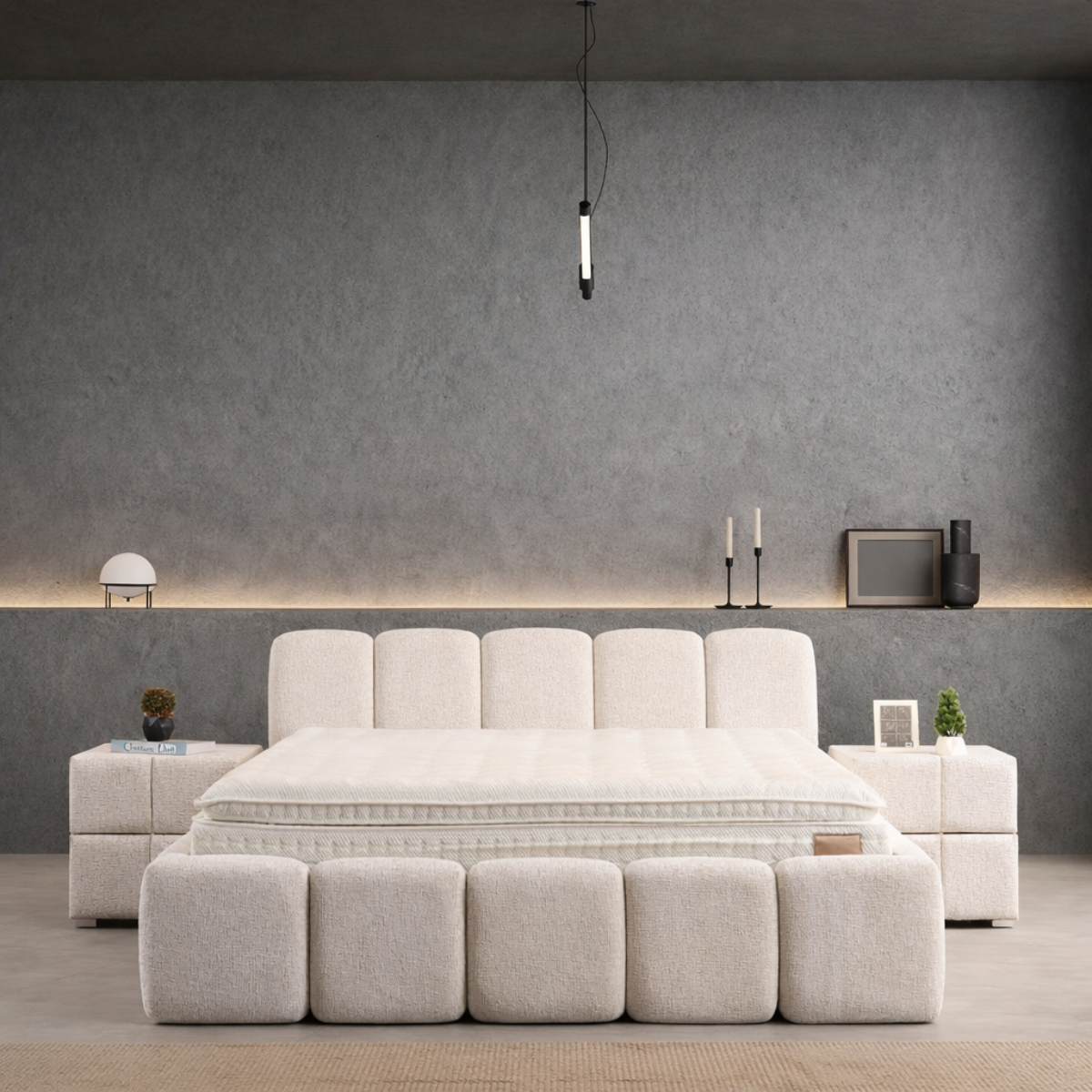 Modern beige sofa in a minimalistic room with gray walls and a pendant light.