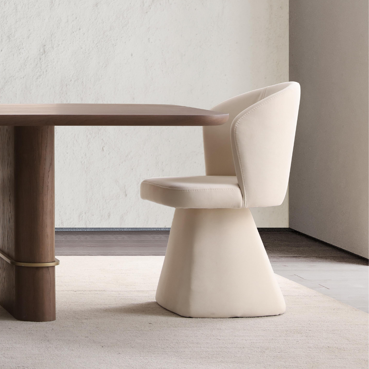 Beige chair next to a wooden table in a minimalistic room.