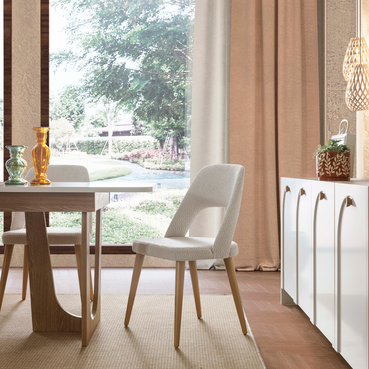 Modern dining room with a table, chairs, and decorative items.