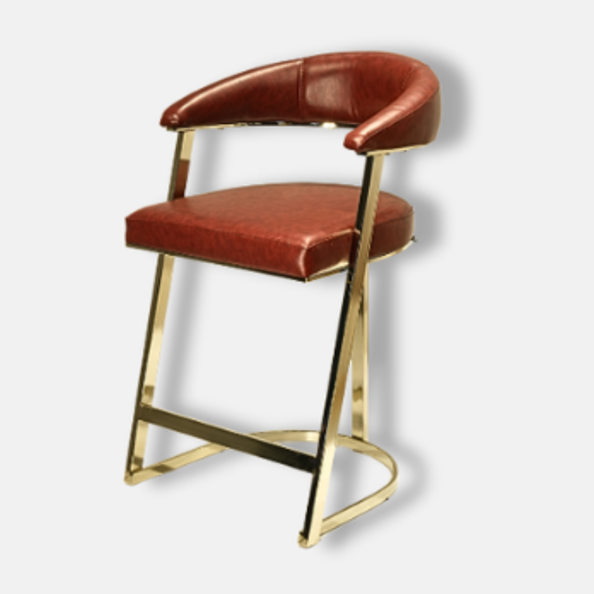 Bar stool with brown leather seat and backrest on a gold frame against a light gray background